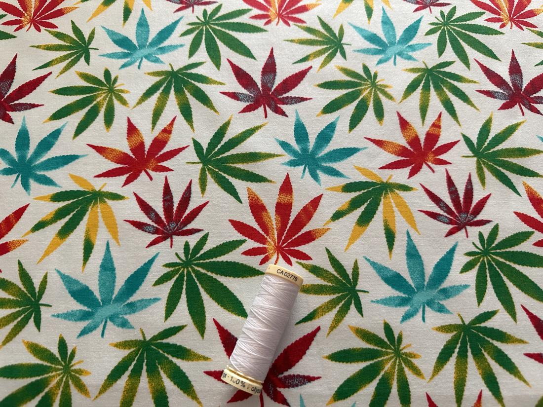 Multi Color Leaves on a Ivory Background 100% Cotton