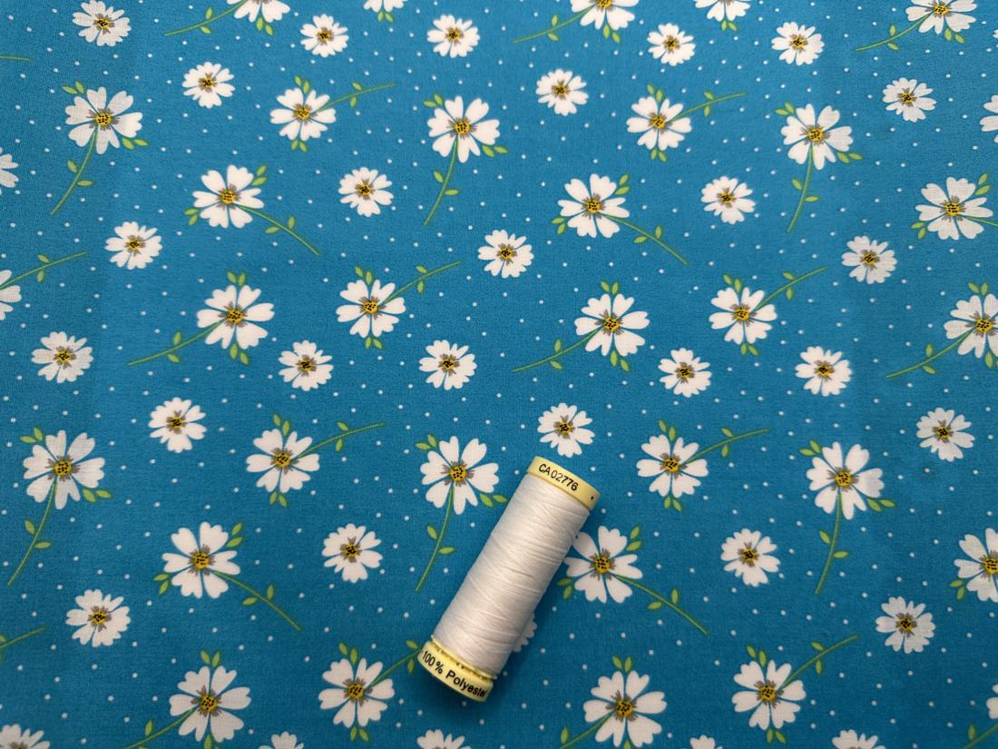 Daisy Spot on a Teal Background Poly Cotton