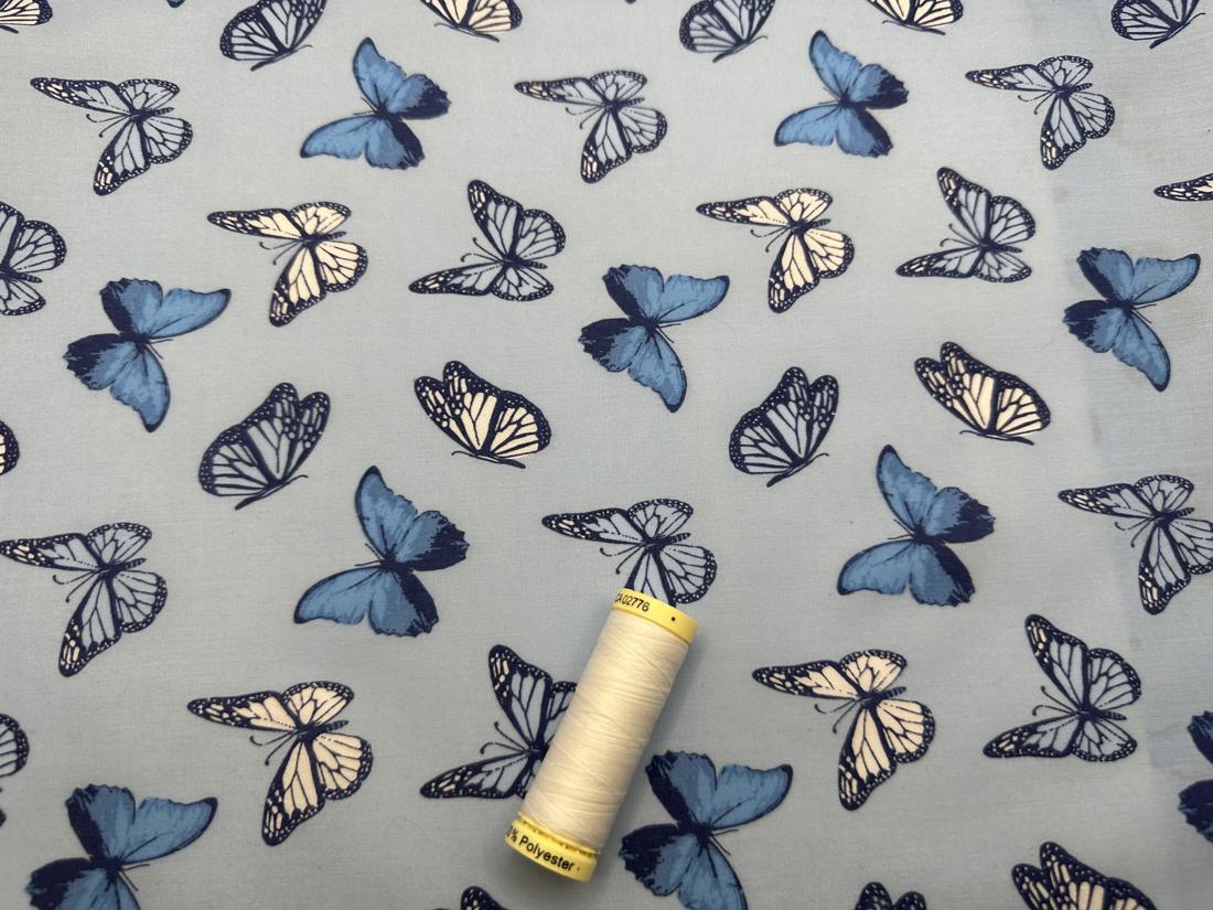 Butterflies on a Denim Background Poly Cotton