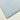 Plain sky blue 100% cotton fabric folded on a white surface, ideal for sewing and crafts