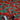 Bright red poppies digital print on soft 100% cotton fabric with green background, ideal for quilting and dressmaking.