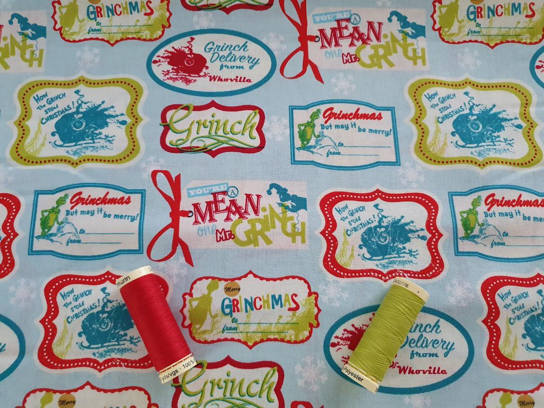 The Grinch Christmas Tags By Dr. Seuss on a Sky Blue Background 100% Cotton Licensed
