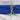 Folded plain royal blue 100% cotton fabric tied with rustic twine on white fabric background