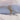 Plain sky blue 100% cotton fabric rolled and tied with twine on white cloth background