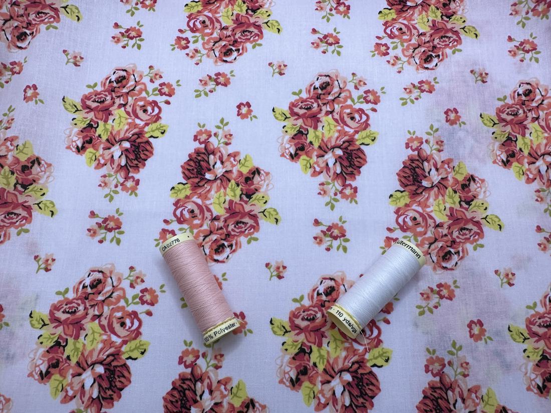 Vintage Floral Design on a Light Pink Background Poly Cotton