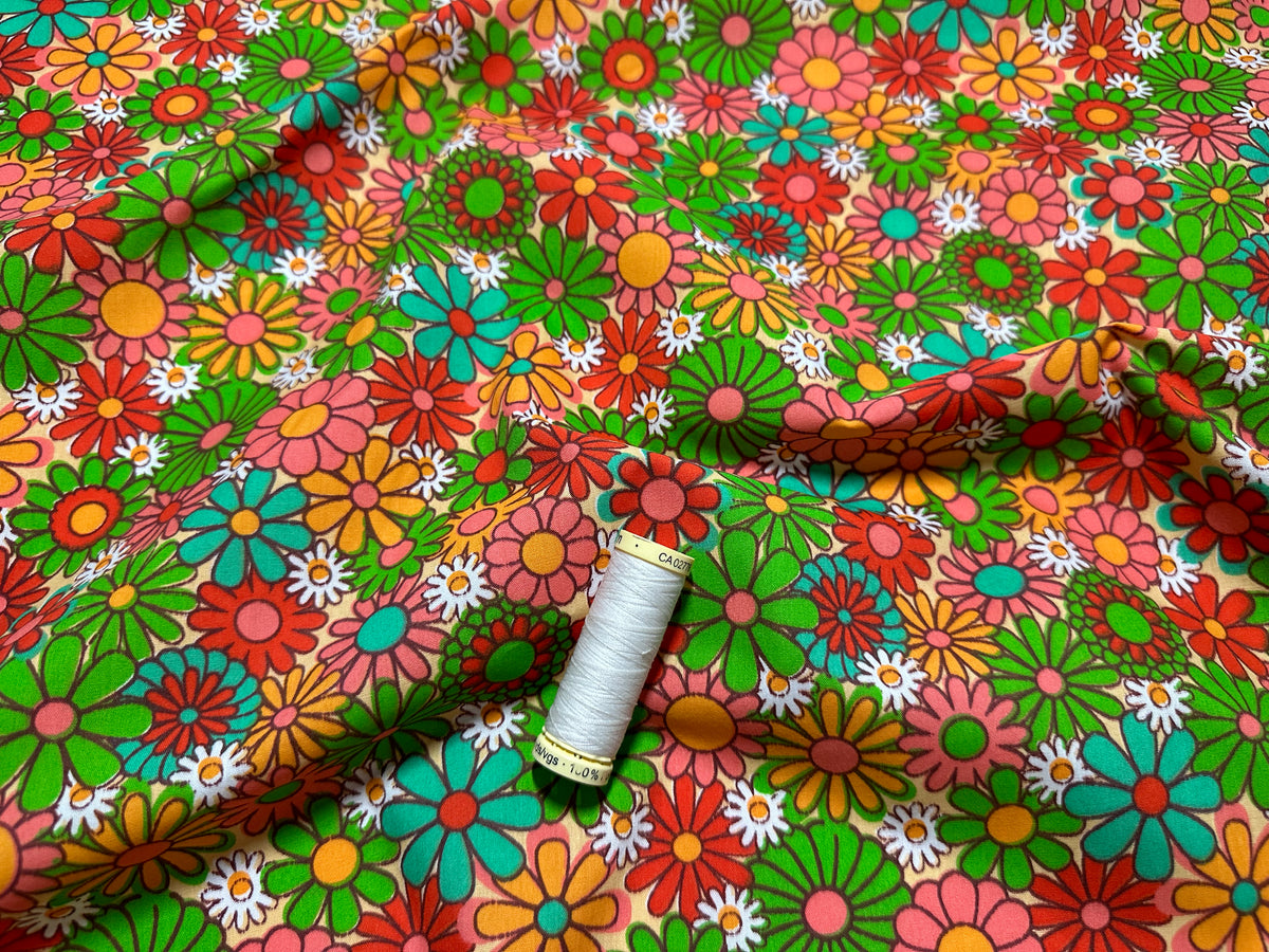 Retro Multi Floral Mix on a Peach Background Poly Cotton