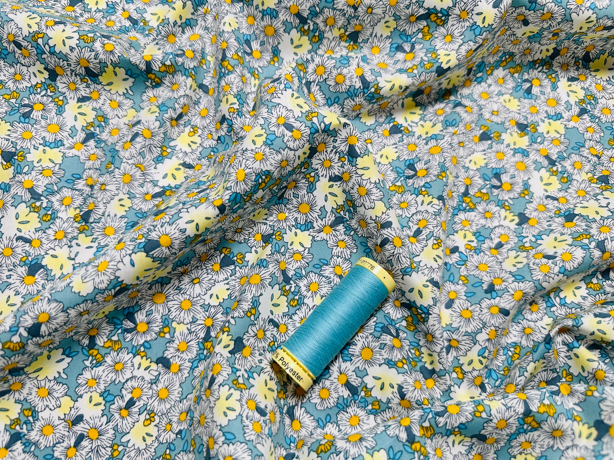 Field of Pretty Little Daisies on a Aqua Background 100% Cotton