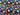 Bright multi-color space planets starburst digital print fabric on blue and black background with thread spools.