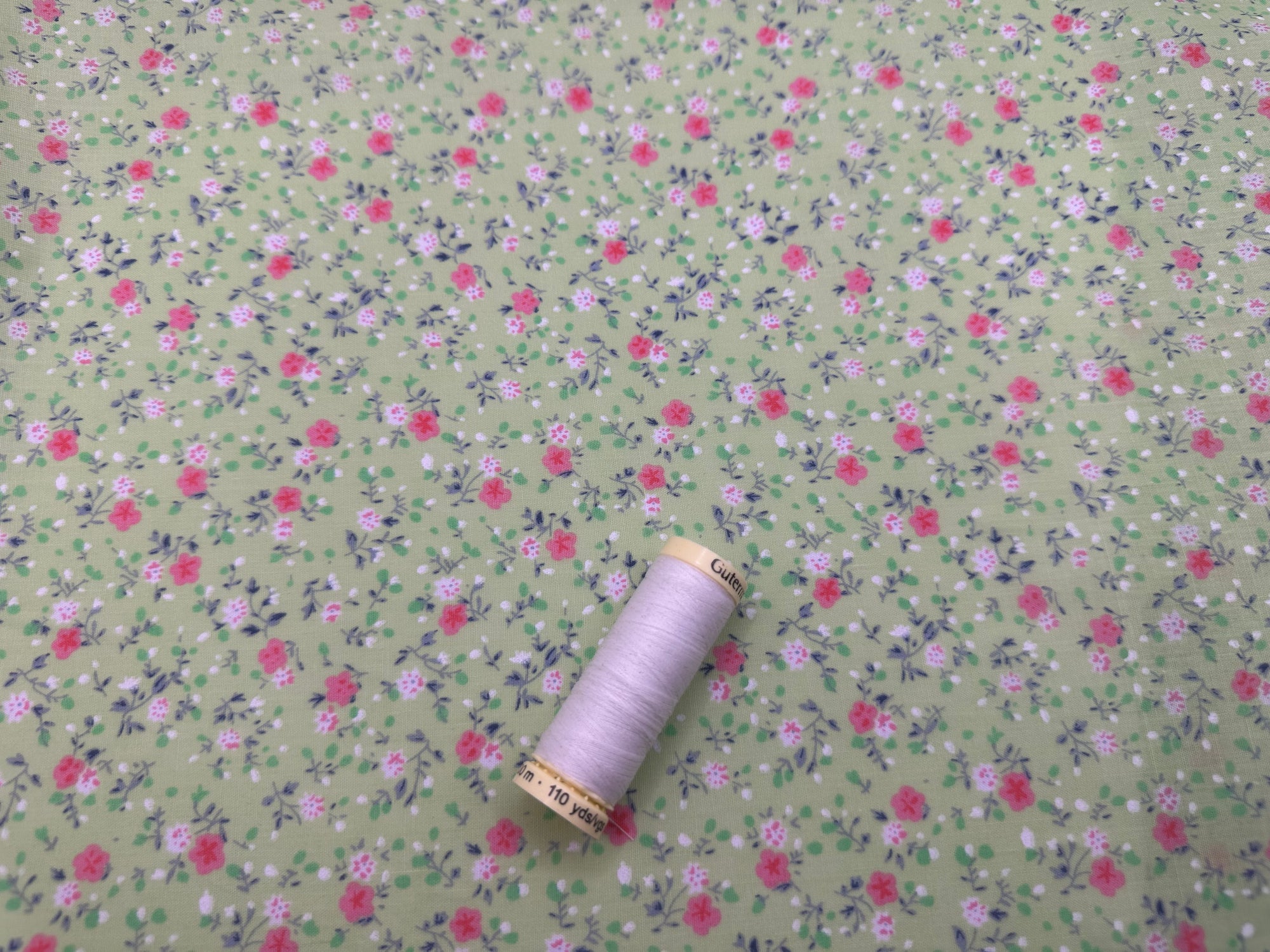 Ditsy Flowers Pink & Blue on a Lime Background Poly Cotton