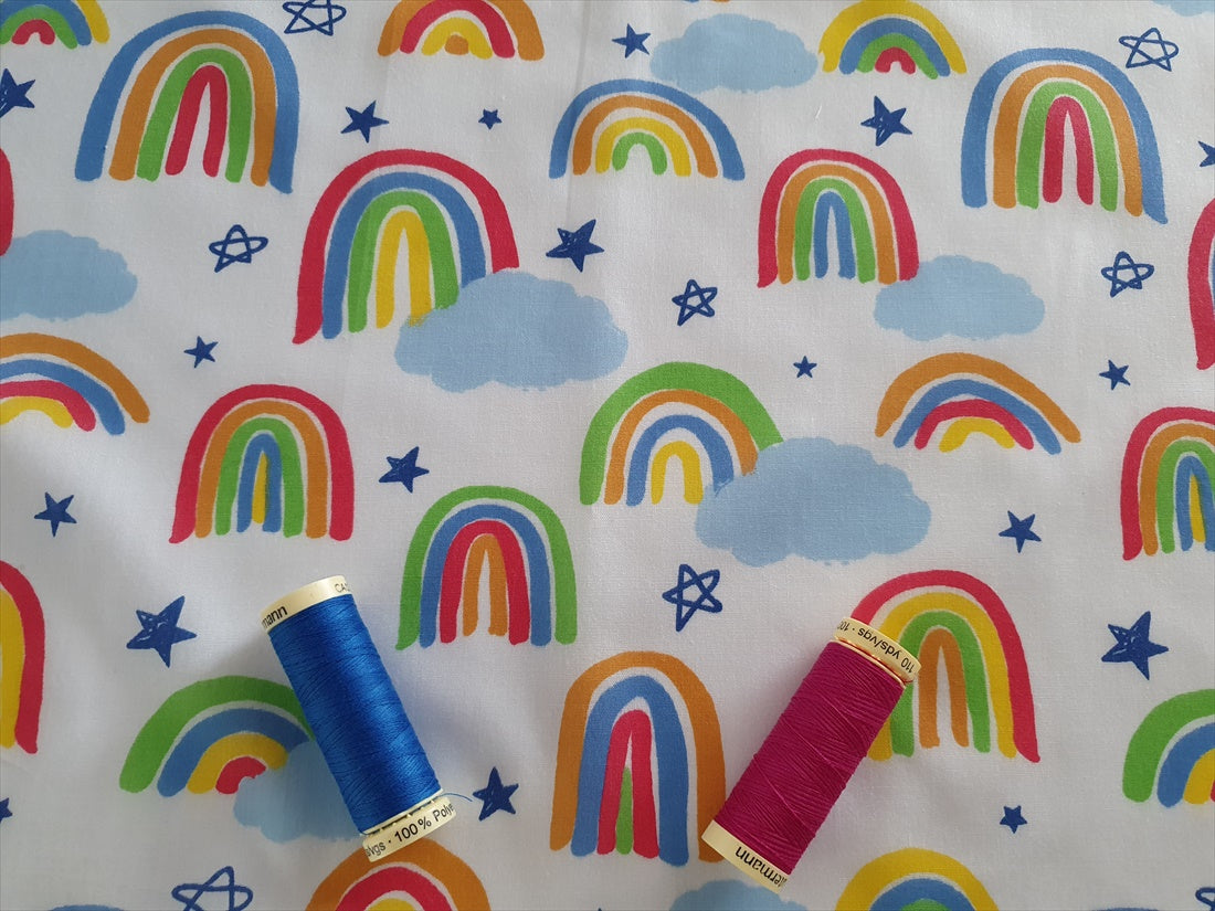 Bright Rainbows & Clouds on a White Background Poly Cotton