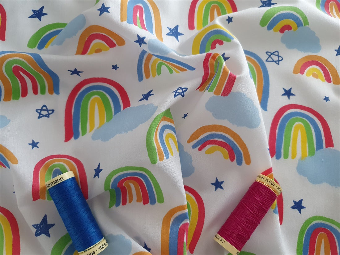 Bright Rainbows &amp; Clouds on a White Background Poly Cotton