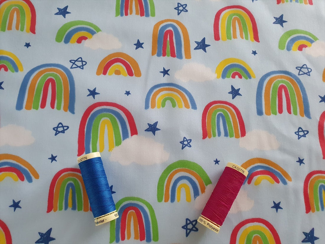 Bright Rainbows & Clouds on a Sky Blue Background Poly Cotton
