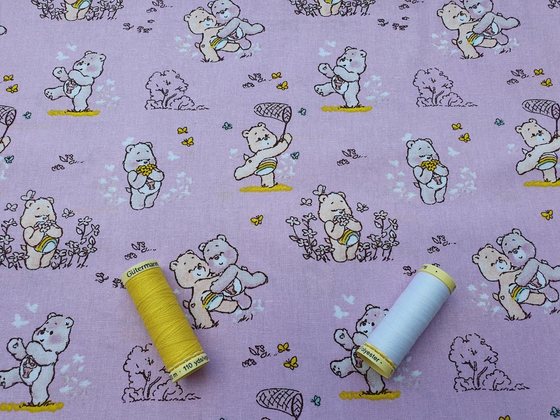 Care Bears Cheer & Share on a Lilac Background - Licensed 100% Cotton