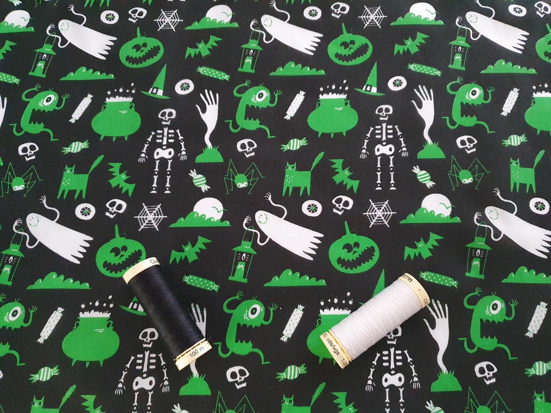 Halloween Scary Assortment Green & White on a Black Background Poly Cotton