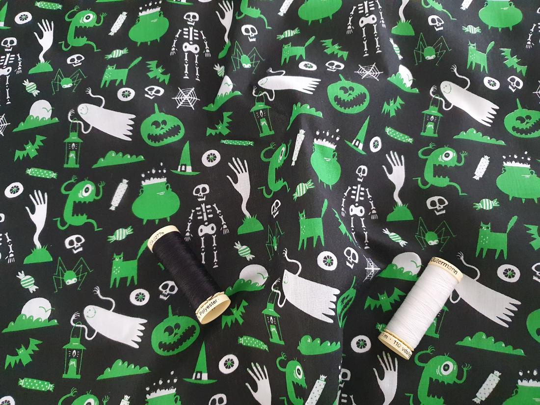 Halloween Scary Assortment Green & White on a Black Background Poly Cotton