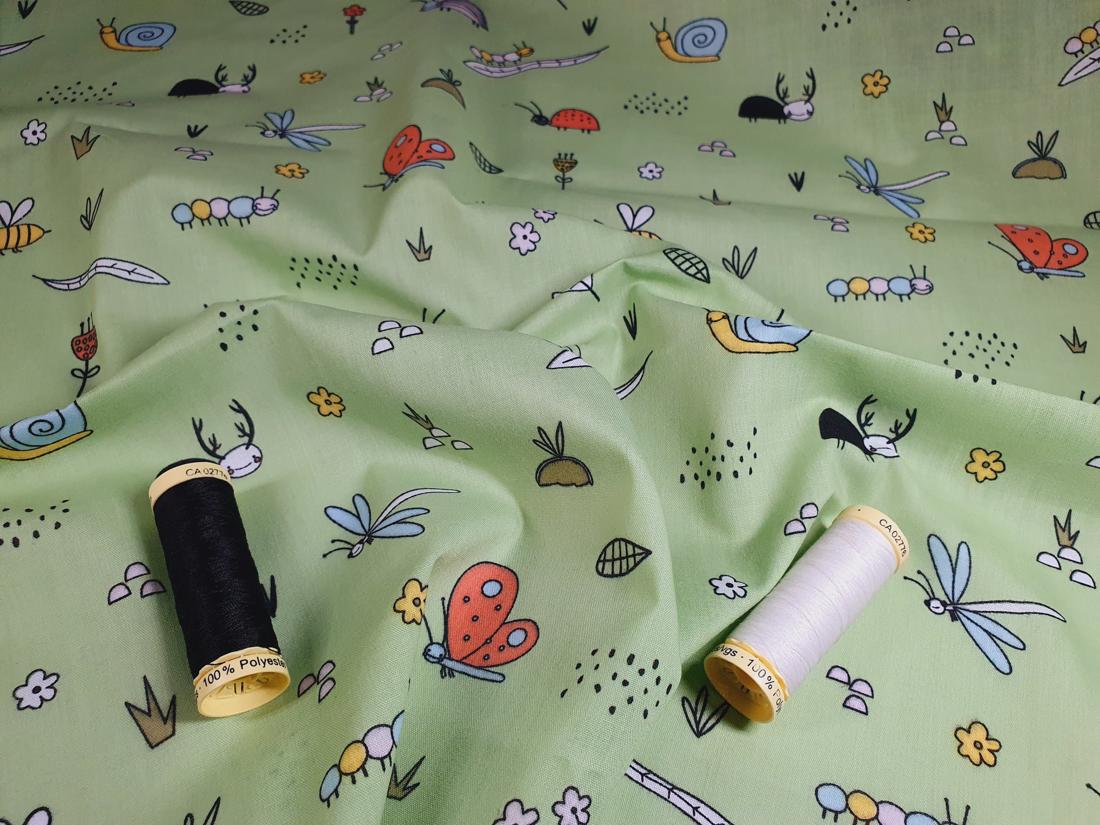 Bugs Life on a Sage Background Poly Cotton