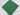 Folded plain emerald green poly cotton fabric on white background