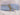 Plain sky blue 100% cotton fabric rolled and tied with twine on white cloth background