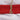 Folded plain red 100% cotton fabric tied with twine on white fabric background